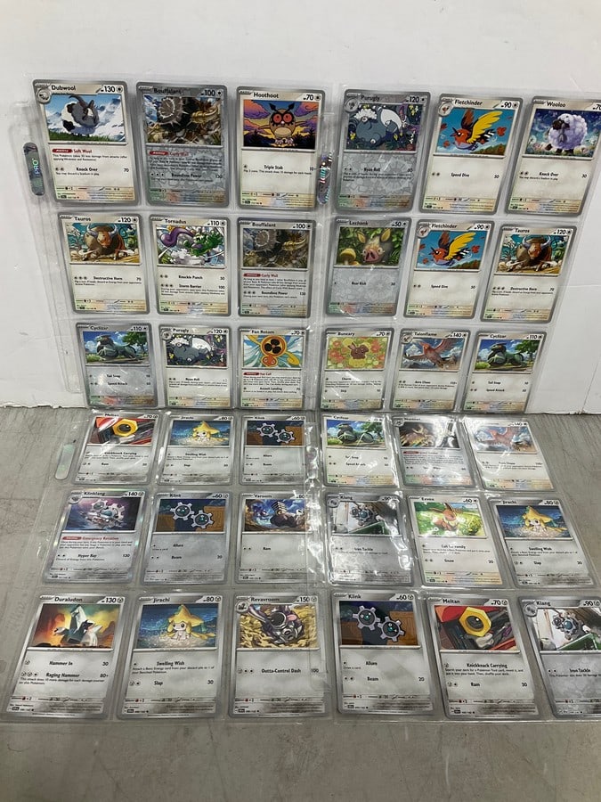 Various Pokemon cards in collector sheets (1 of 1)