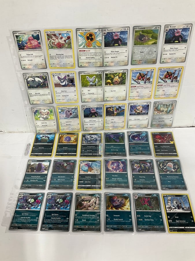 Various Pokemon cards in collector sheets (1 of 1)