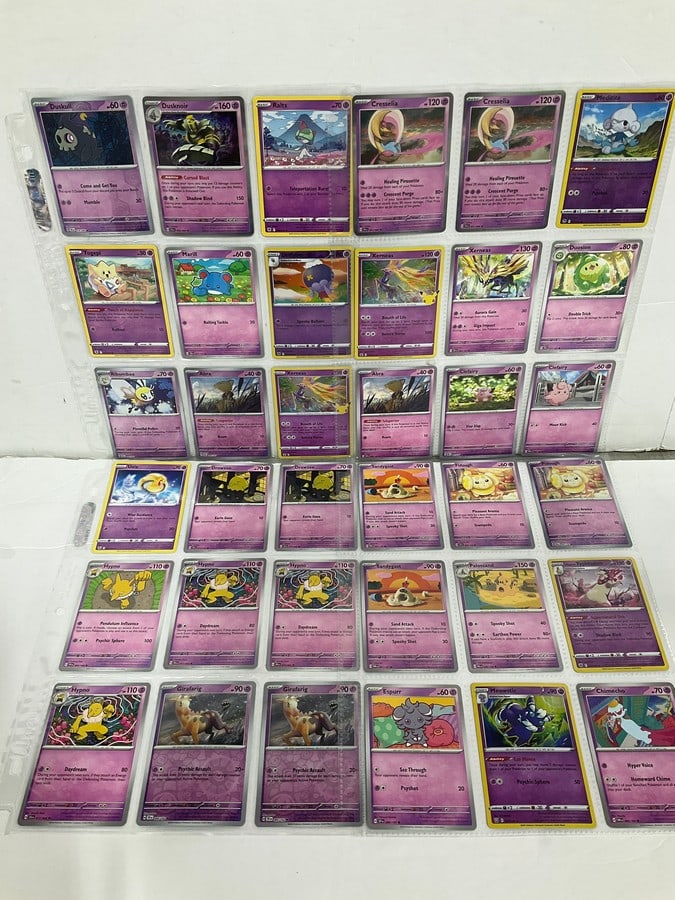 Various Pokemon cards in collector sheets (1 of 1)