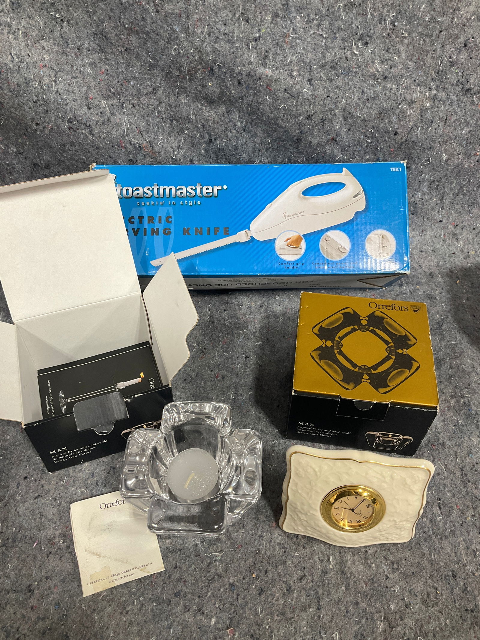 Electric carving knife, Orrefors crystal candleholders, and Lenox clock: Electric carving knife, Orrefors crystal candleholders, and Lenox clock