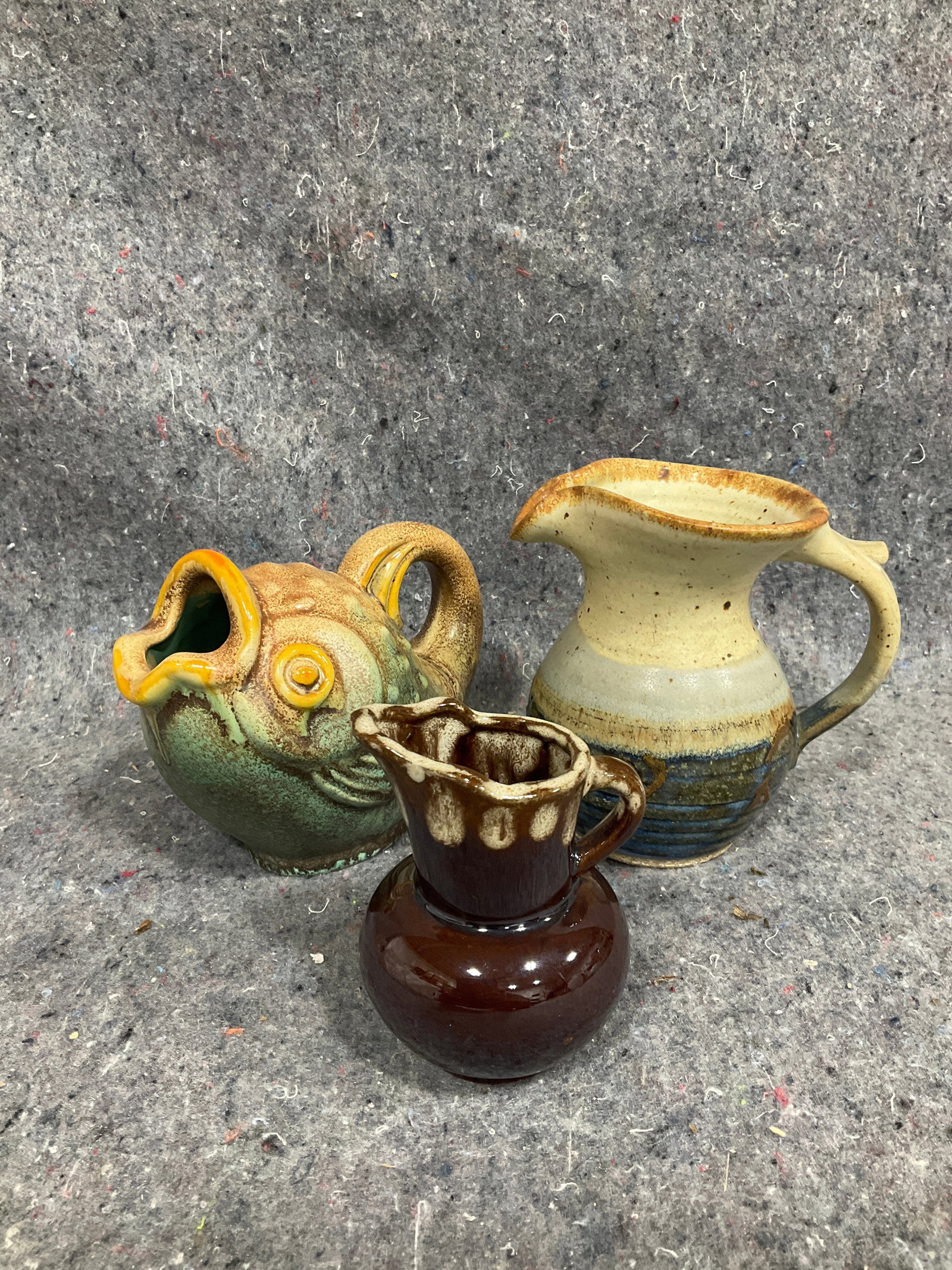 Stoneware pitchers and glossed pottery pitcher(tallest 5in): Stoneware pitchers and glossed pottery pitcher(tallest 5in)