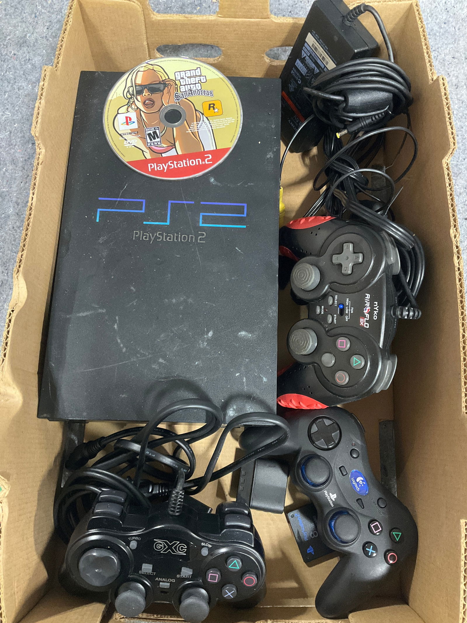 Playstation 2, controllers, and Grand Theft Auto game: Playstation 2, controllers, and Grand Theft Auto game