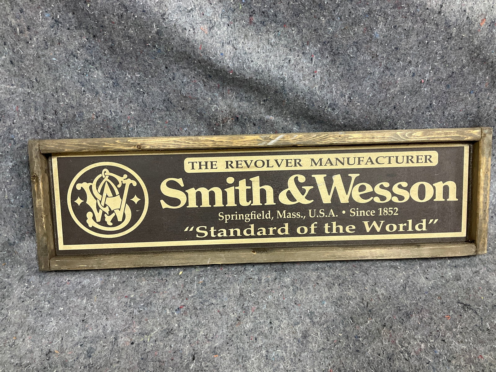 Wooden framed Smith & Wesson wall decor(7.5inx25in): Wooden framed Smith & Wesson wall decor(7.5inx25in)