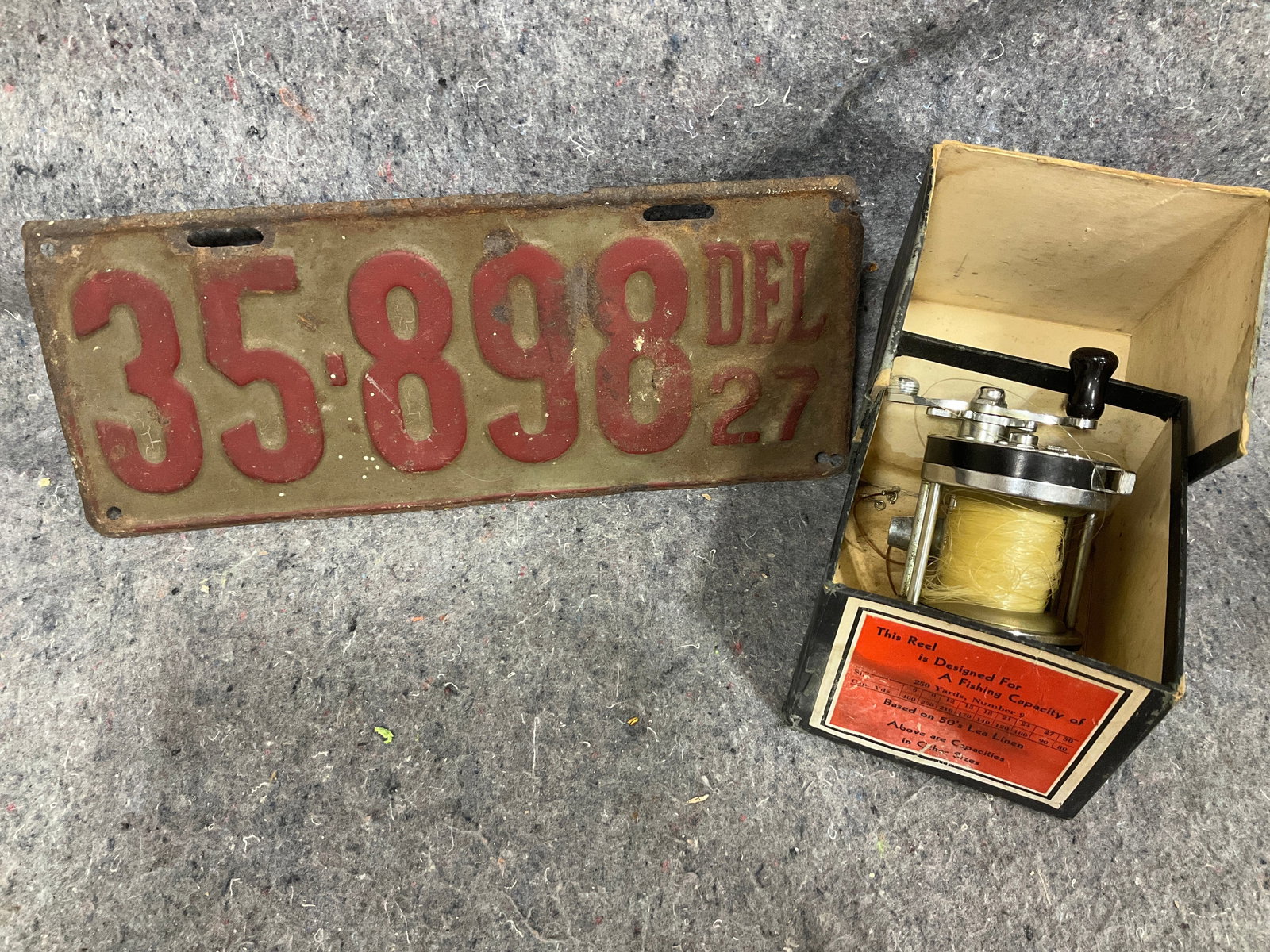 Vintage license plate and fishing reel (1 of 1)