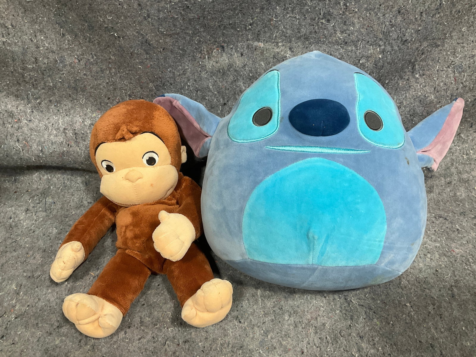 Universal Studios curious George plush and Disney Stitch squishmallow: Universal Studios curious George plush and Disney Stitch squishmallow