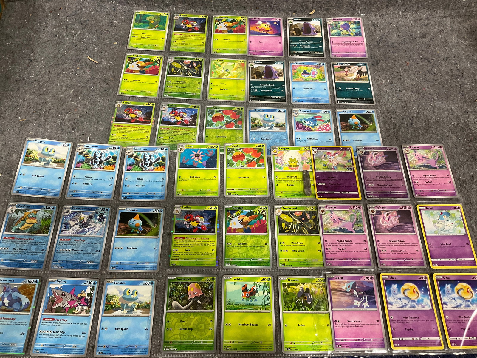 Various Pokemon cards in collector sheets (1 of 1)