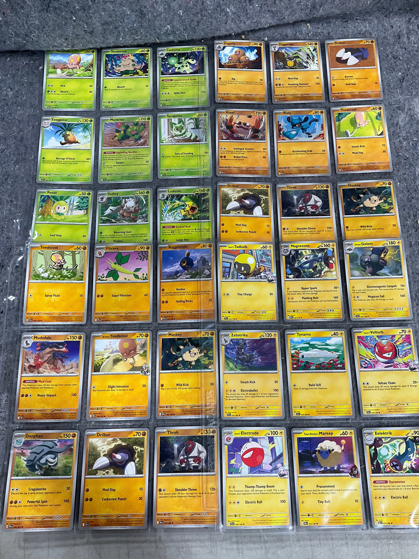 Various Pokemon cards in collector sheets (1 of 1)