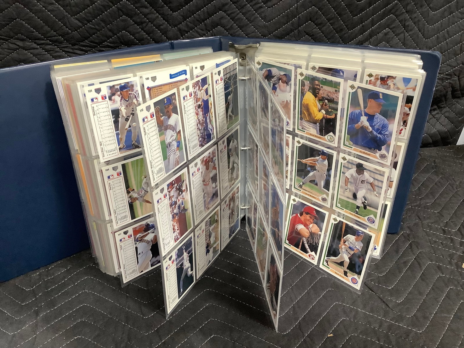 Binder full of sports cards in collector sheets: Binder full of sports cards in collector sheets