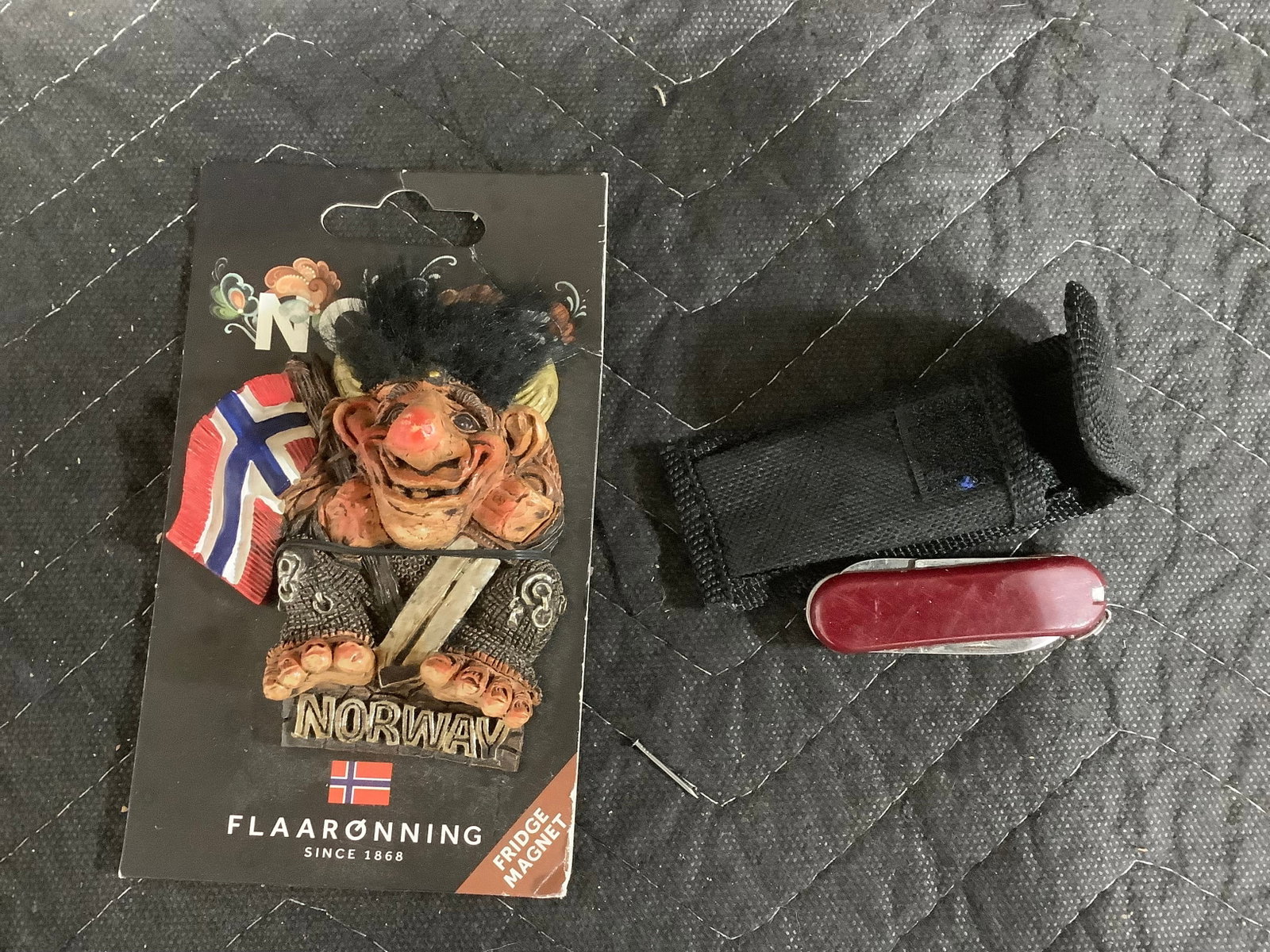 Swiss army knife and fridge magnet: Swiss army knife and fridge magnet