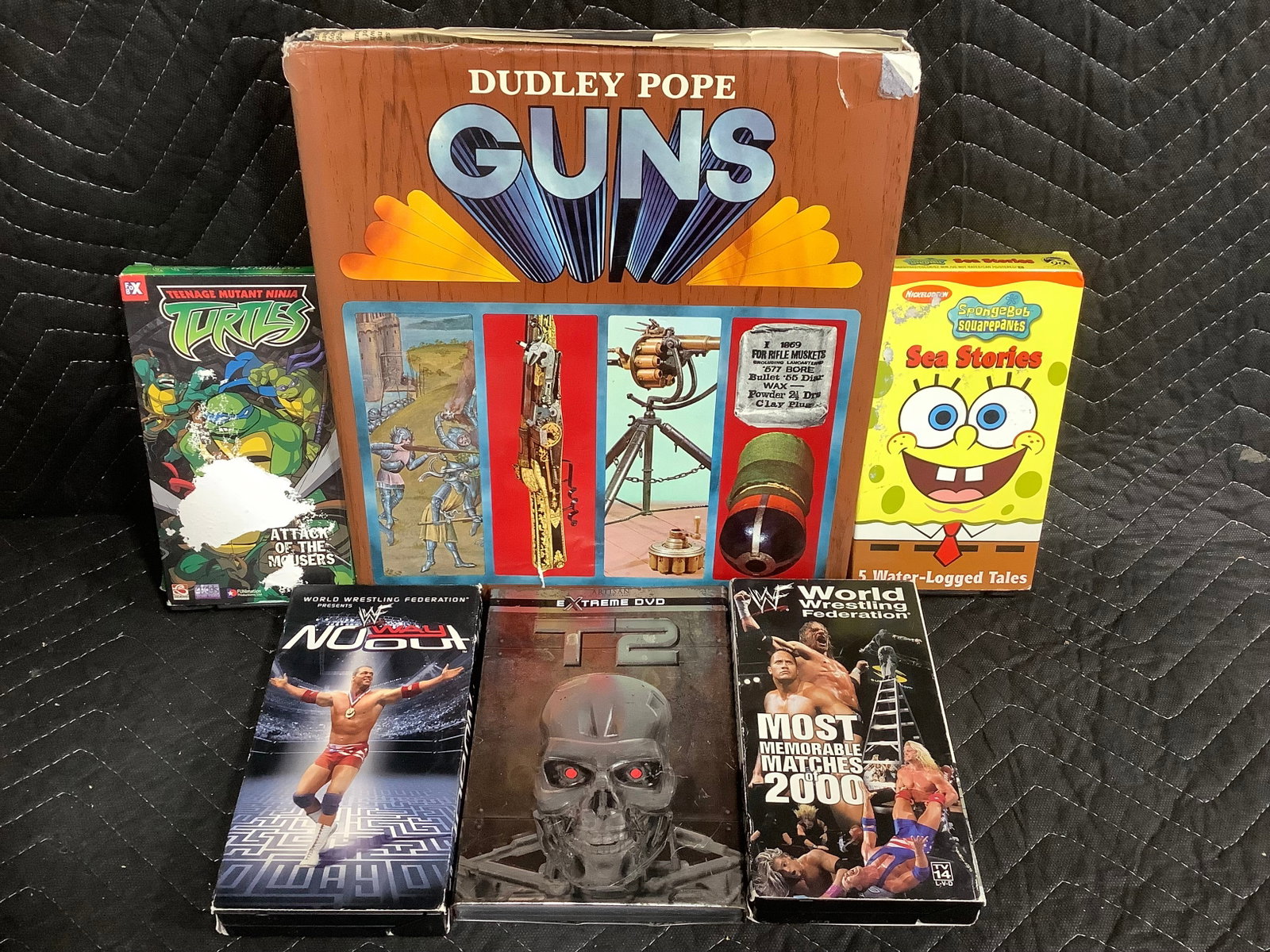 VHS tapes and Dudley Pope guns hardcover book: VHS tapes and Dudley Pope guns hardcover book