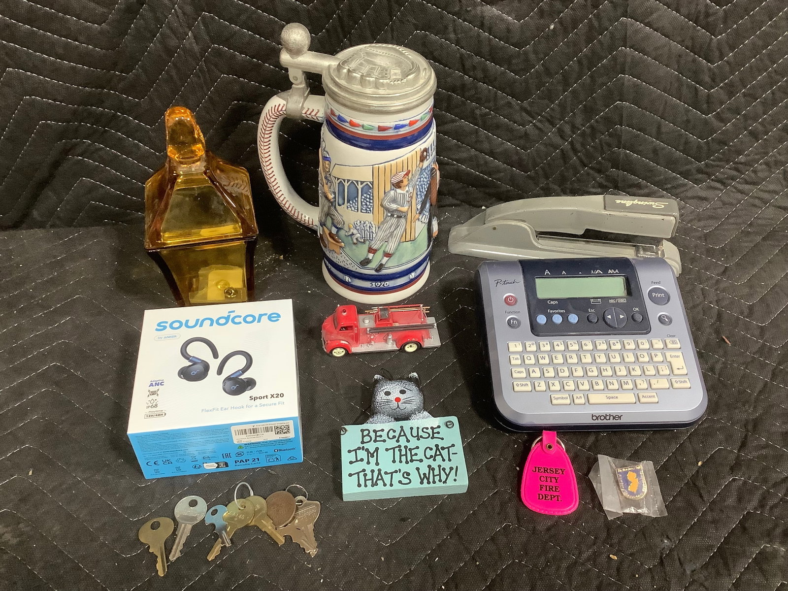 Baseball theme stein(9in tallest), soundcore bluetooth headphones, Brother P Touch machine, and more (1 of 1)