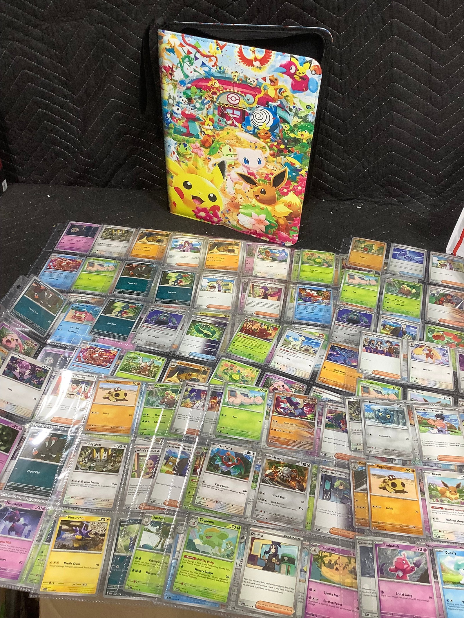 Pokemon binder with Pokemon cards inside (1 of 1)
