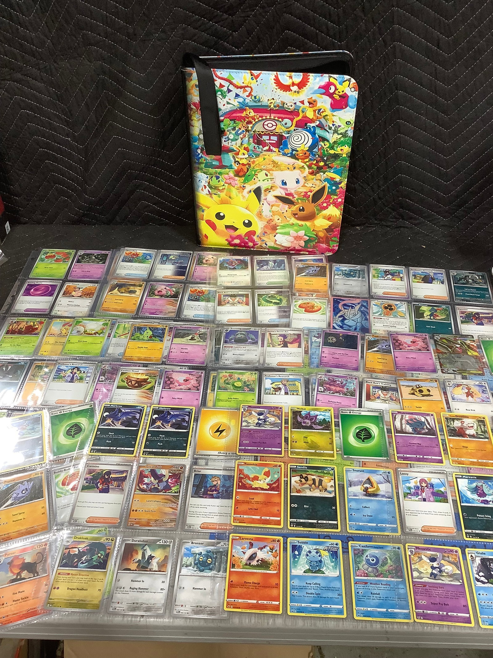 Pokemon binder with Pokemon cards inside (1 of 1)