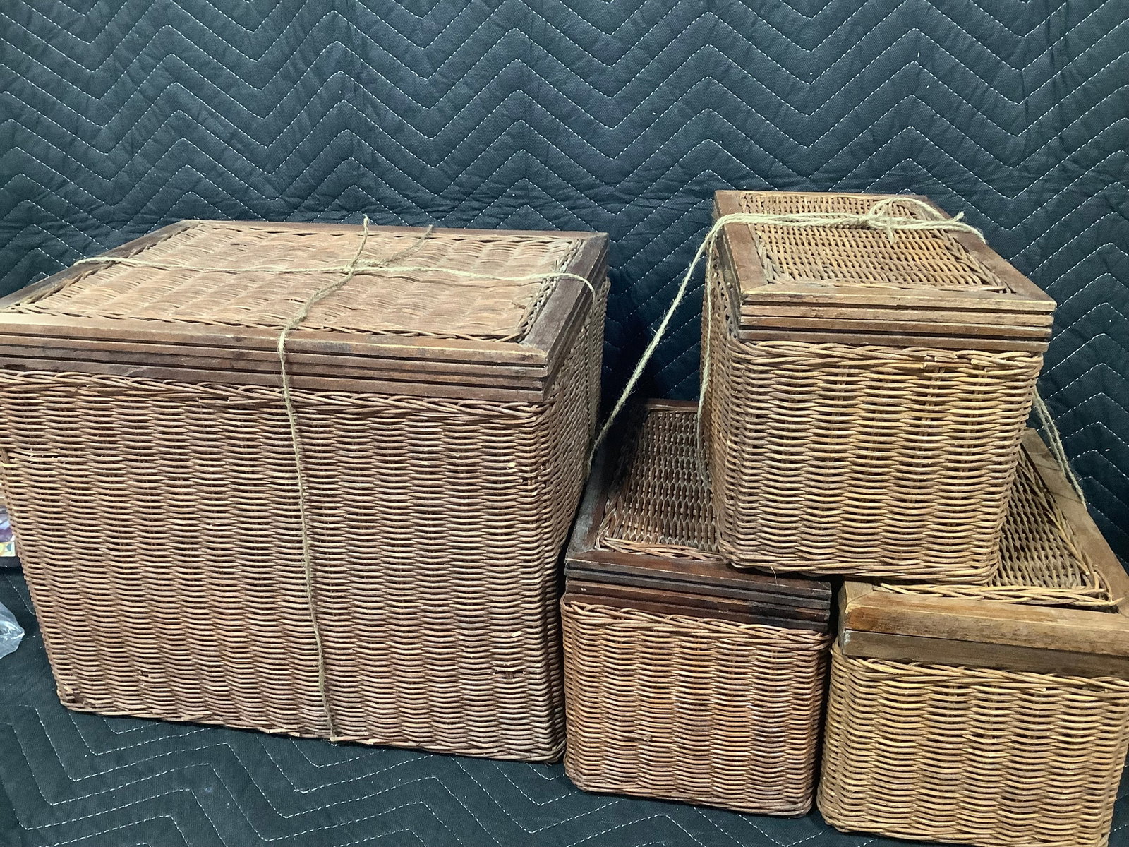 Woven covered baskets with wooden frames and hinged lids: Woven covered baskets with wooden frames and hinged lids
