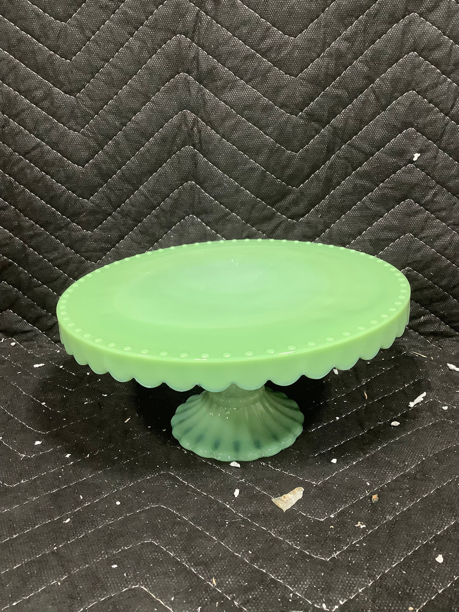 Jade round milk glass pedestal (3.5intall, 8in across): Jade round milk glass pedestal (3.5intall, 8in across)