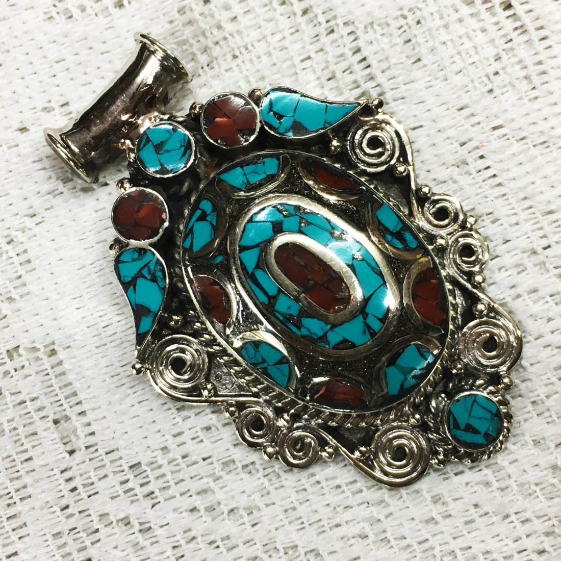 Buddhist Turquoise & Coral Vintage Tibet Pendant: Incredible one of a kind pieces for all occasions. Great for yourself, gifts for friends, or even to sell in your own store!! We are now offering wholesale prices! Item: Antique Tibetan Handnad
