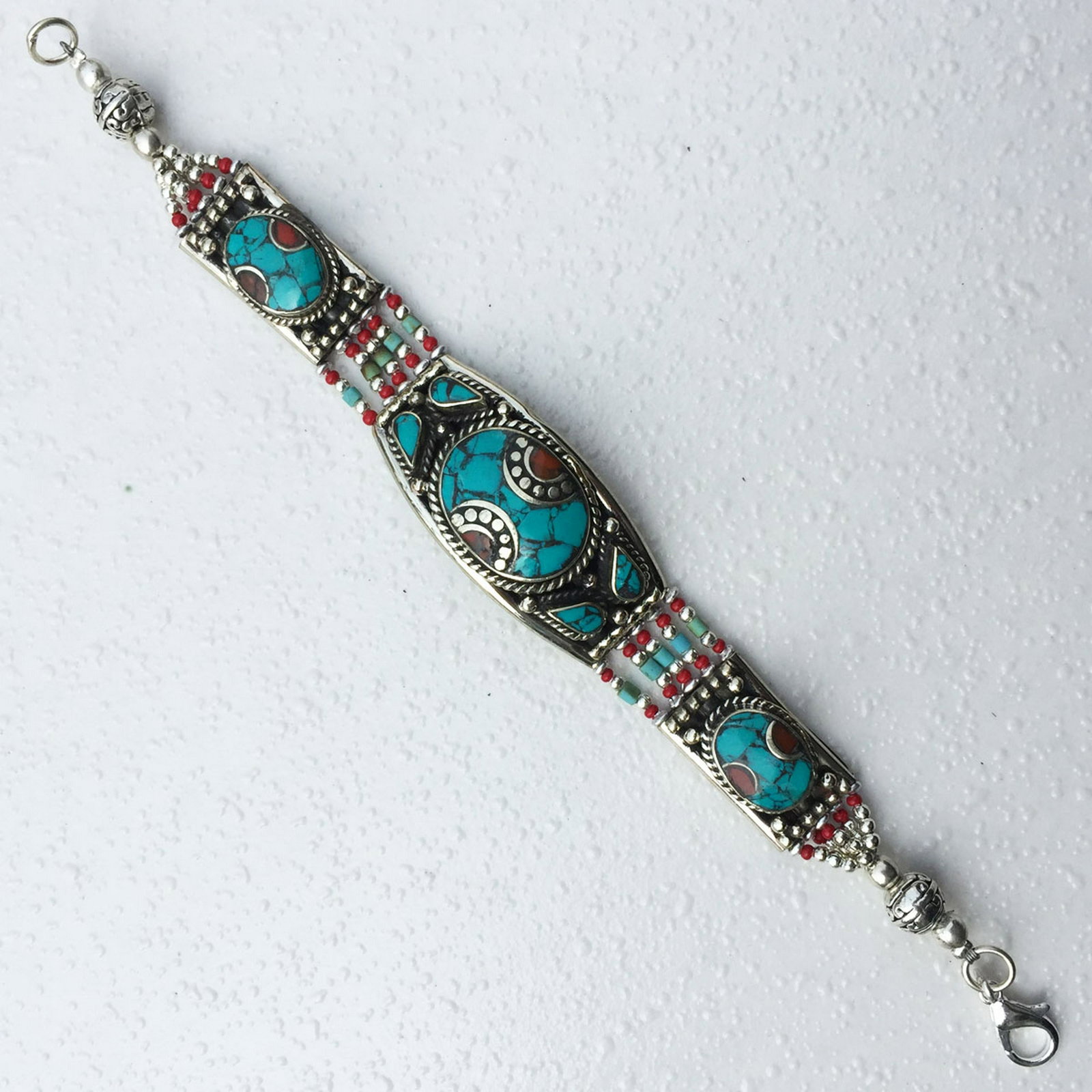 Nepalese Lapis & Turquoise Tibetan Bracelet: Tibetan Handmade Ethnic Bracelet Main Stone: Turquoise & Coral Metal: Tibetan Silver Length (inches): 6 to 7 Weight: 30 Gram Approx Material: Stone Brand: Handmade Style: Bohemian Ethnic Origin: Tibet