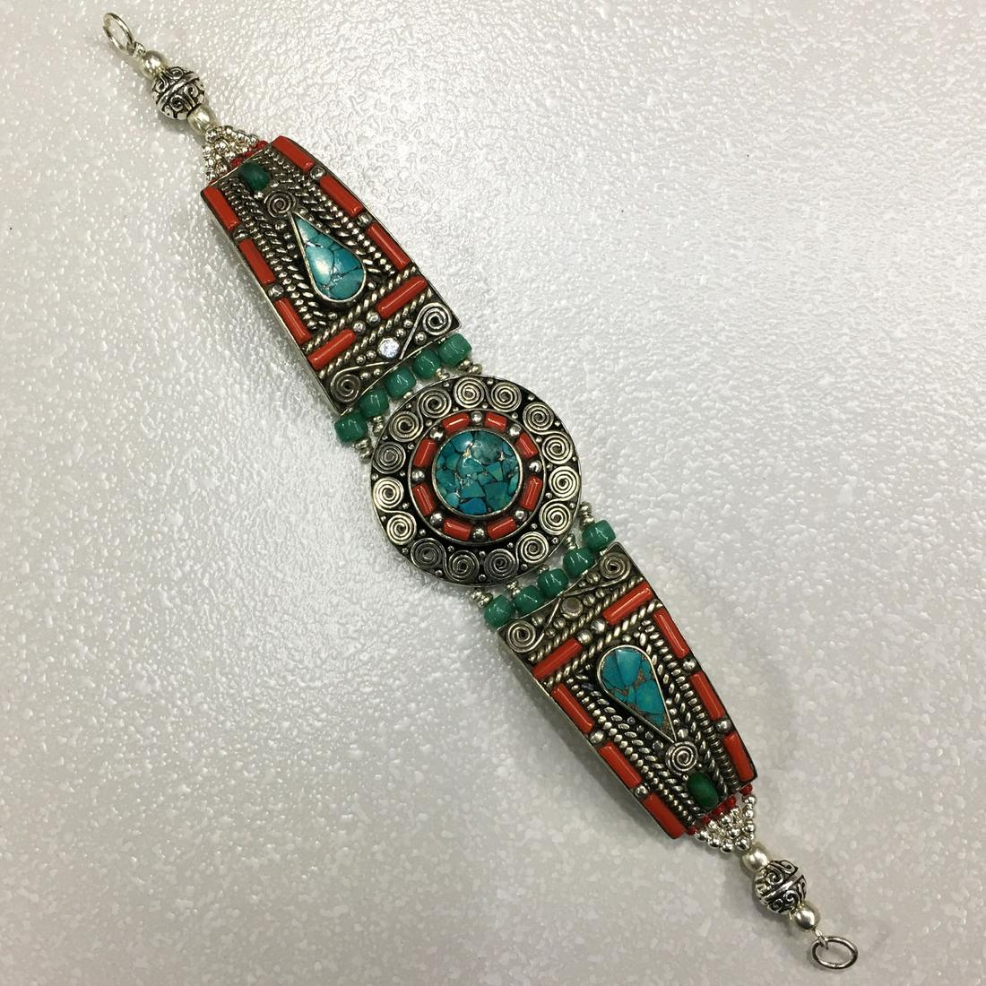 Tibetan Turquoise & Coral Unique Handmade Bracelet: TIBETAN TURQUOISE & CORAL HANDMADE BRACELET Weight: 35 Gram Approx Gemstones: Turquoise & Coral, Lapis Brand: Handmade Bracelet Length: 6 to 7 Inch Country/Region of Manufacture: Kathmandu/Nepal