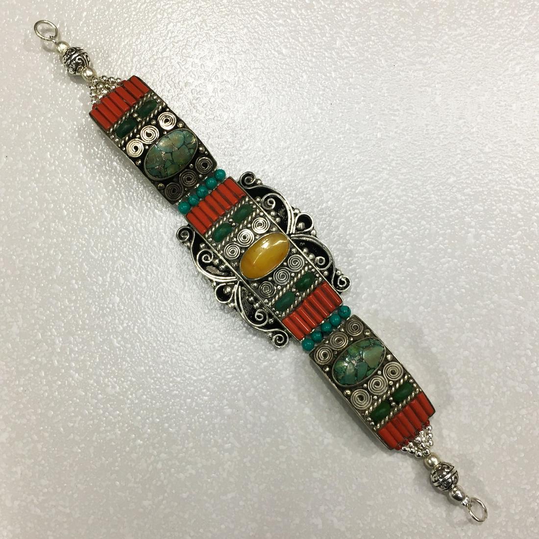 Traditional Tibetan Turquoise & Amber Bracelet: TIBETAN TURQUOISE & CORAL HANDMADE BRACELET Weight: 35 Gram Approx Gemstones: Turquoise & Coral, Lapis Brand: Handmade Bracelet Length: 6 to 7 Inch Country/Region of Manufacture: Kathmandu/Nepal