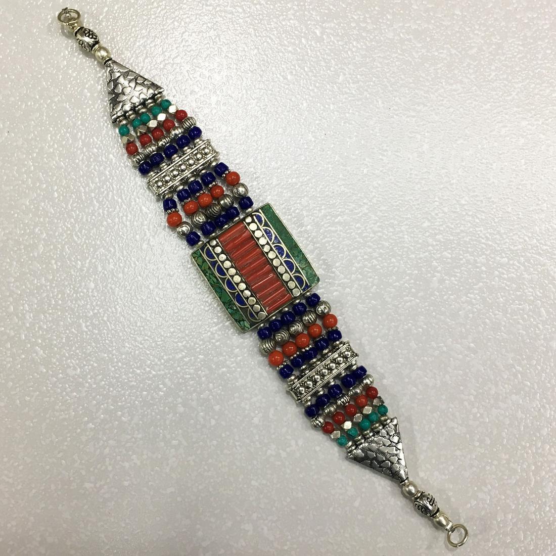 Tibetan Ethnic Vintage Turquoise & Coral Bracelet: TIBETAN TURQUOISE & CORAL HANDMADE BRACELET Weight: 35 Gram Approx Gemstones: Turquoise & Coral, Lapis Brand: Handmade Bracelet Length: 6 to 7 Inch Country/Region of Manufacture: Kathmandu/Nepal