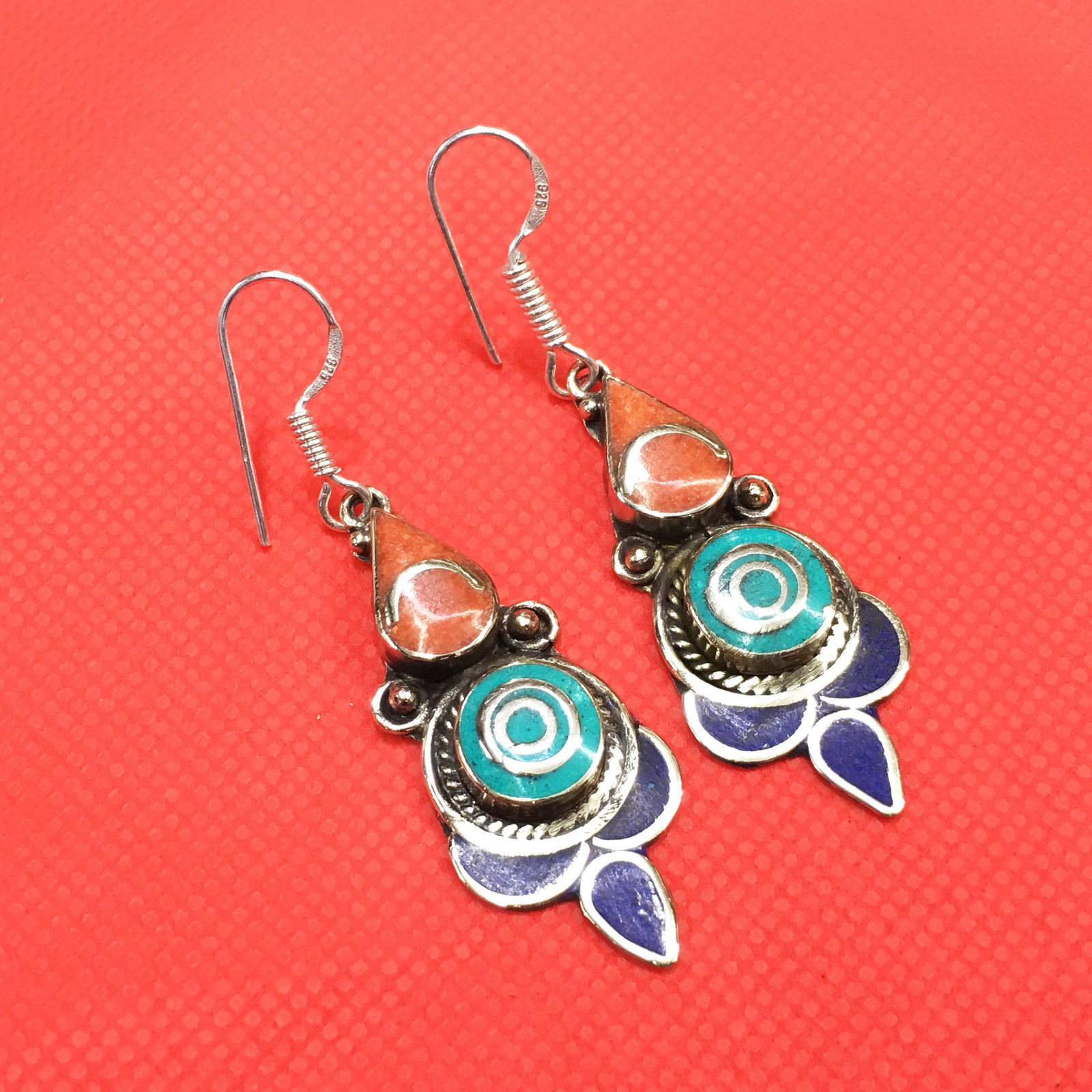 Tibetan Turquoise & Coral Handmade Ethnic Earrings: Tibetan Handmade Ethnic Earrings Main Stone: Turquoise, Coral & Lapis Metal: Tibetan Silver Material: Stone Brand: Handmade Style: Bohemian Ethnic Origin: Tibetan Country/Region of Manufacture: Nepal