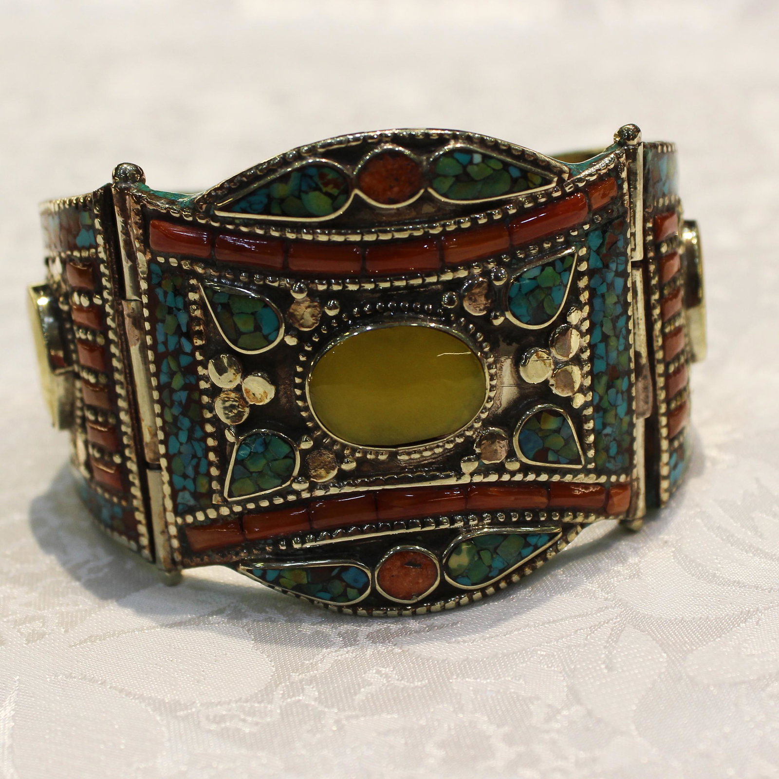 Ethnic Turquoise & Amber Handmade Old Bangle: TIBETAN TURQUOISE & CORAL HANDMADE BANGLE Weight: 100 Gram Approx Gemstones: Turquoise & Coral, Lapis Brand: Handmade Bangle Length: 6 to 7 Inch Country/Region of Manufacture: Kathmandu/Nepal