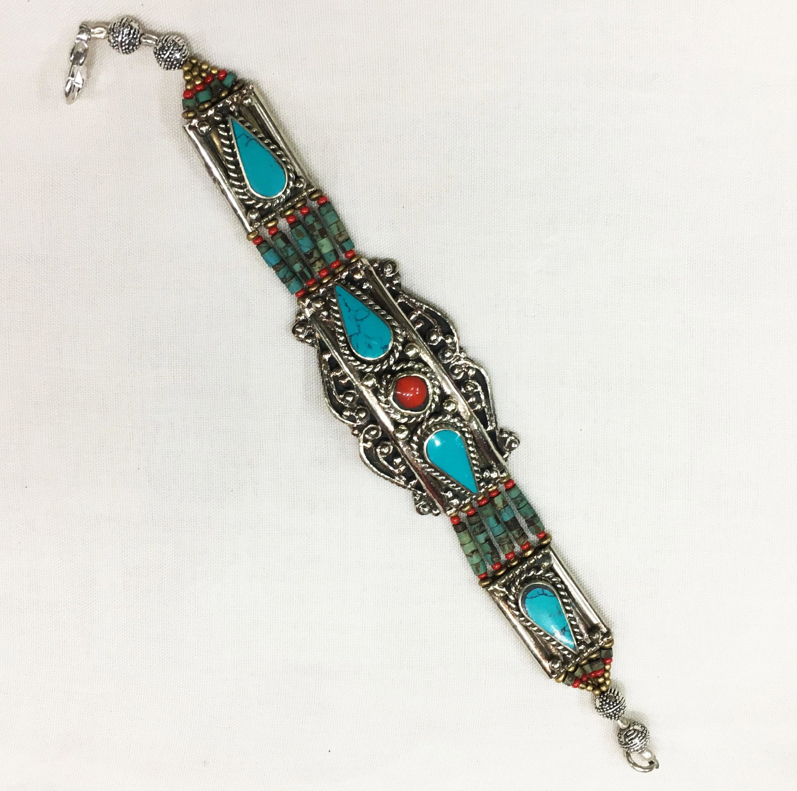 Tibetan Turquoise & Coral Unique Handmade Bracelet: TIBETAN TURQUOISE & CORAL HANDMADE BRACELET Weight: 35 Gram Approx Gemstones: Turquoise & Coral, Lapis Brand: Handmade Bracelet Length: 6 to 7 Inch Country/Region of Manufacture: Kathmandu/Nepal