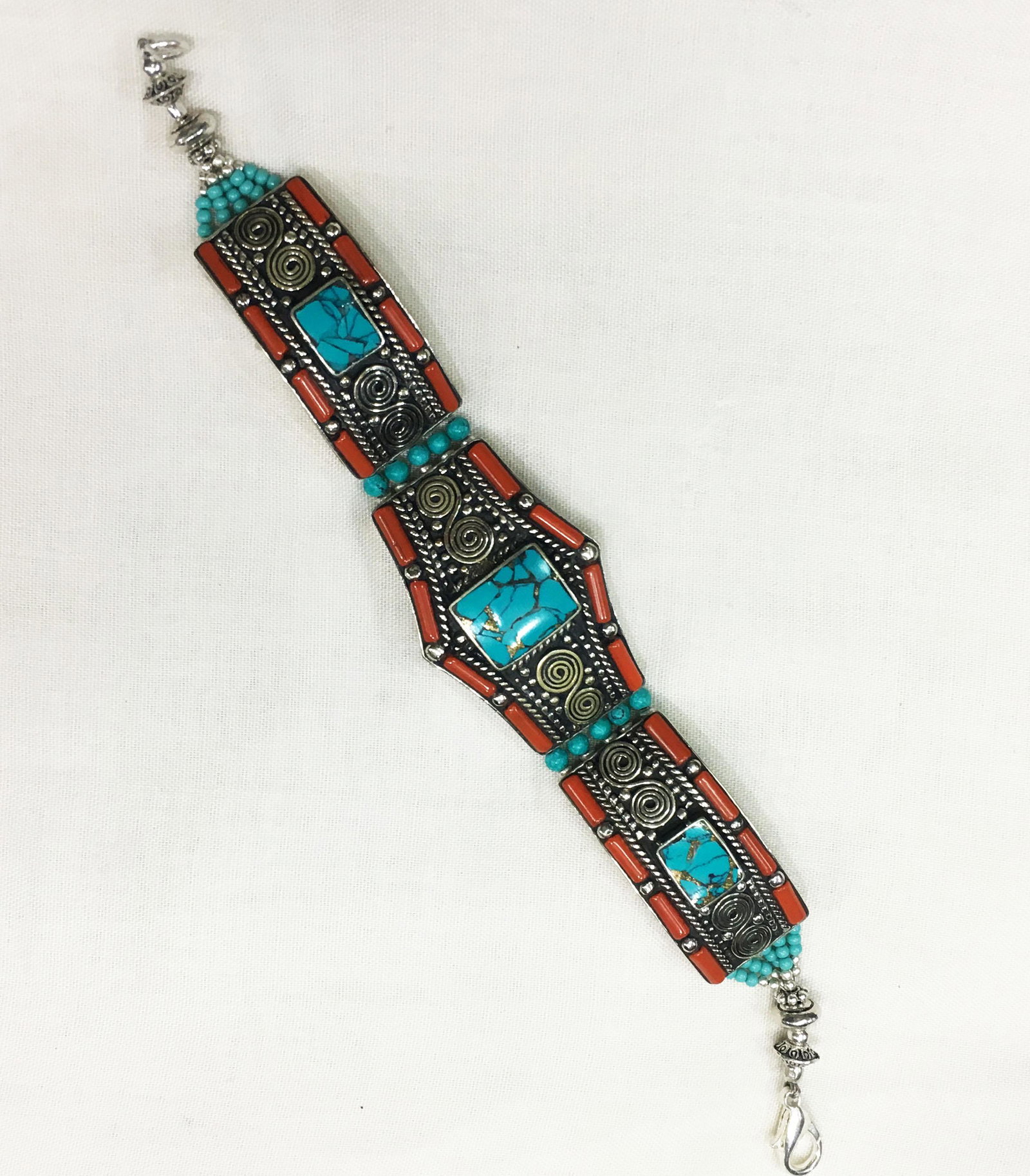 Tibetan Turquoise Unique Handmade Bracelet: TIBETAN TURQUOISE & CORAL HANDMADE BRACELET Weight: 35 Gram Approx Gemstones: Turquoise & Coral, Lapis Brand: Handmade Bracelet Length: 6 to 7 Inch Country/Region of Manufacture: Kathmandu/Nepal
