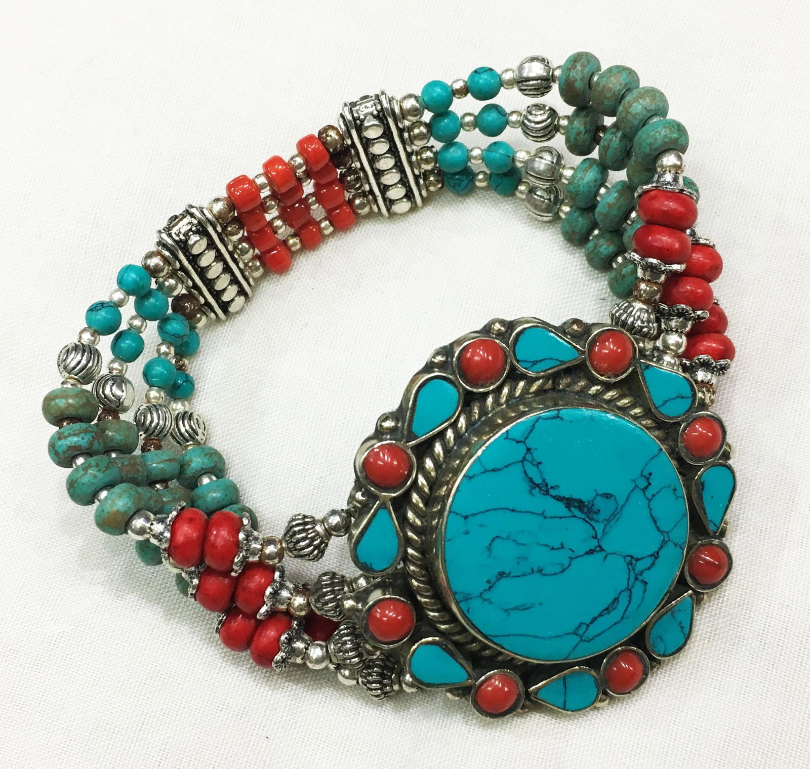 Tibetan Turquoise Unique Handmade Boho Bracelet: TIBETAN TURQUOISE & CORAL HANDMADE BRACELET Weight: 35 Gram Approx Gemstones: Turquoise & Coral, Lapis Brand: Handmade Bracelet Length: 6 to 7 Inch Country/Region of Manufacture: Kathmandu/Nepal