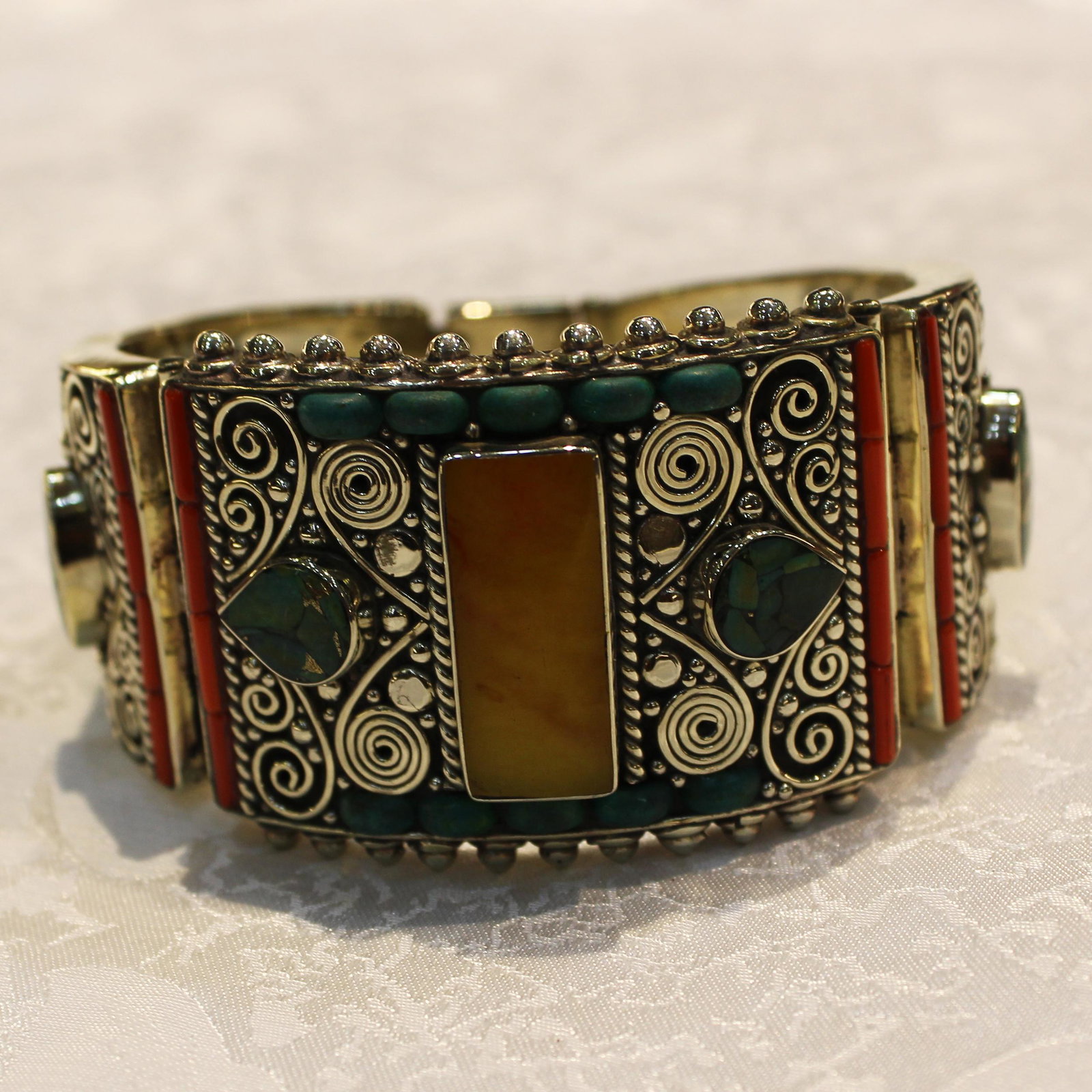 Ethnic Turquoise & Amber Handmade Old Bangle: TIBETAN TURQUOISE & CORAL HANDMADE BANGLE Weight: 100 Gram Approx Gemstones: Turquoise & Coral, Lapis Brand: Handmade Bangle Length: 6 to 7 Inch Country/Region of Manufacture: Kathmandu/Nepal