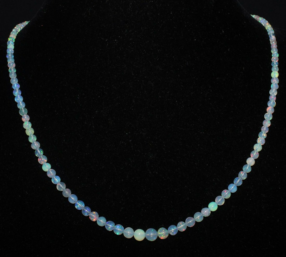 Natural Ethiopian Welo Fire Opal Balls Necklace: Shape: RoundlleCut Grade: Very Good Country of Origin: EthiopiaColor: Multi-ColorCountry/Region of Manufacture: IndiaTransparency: Transparent Natural/Lab-Created: NaturalTreatment: None (No Enhanceme