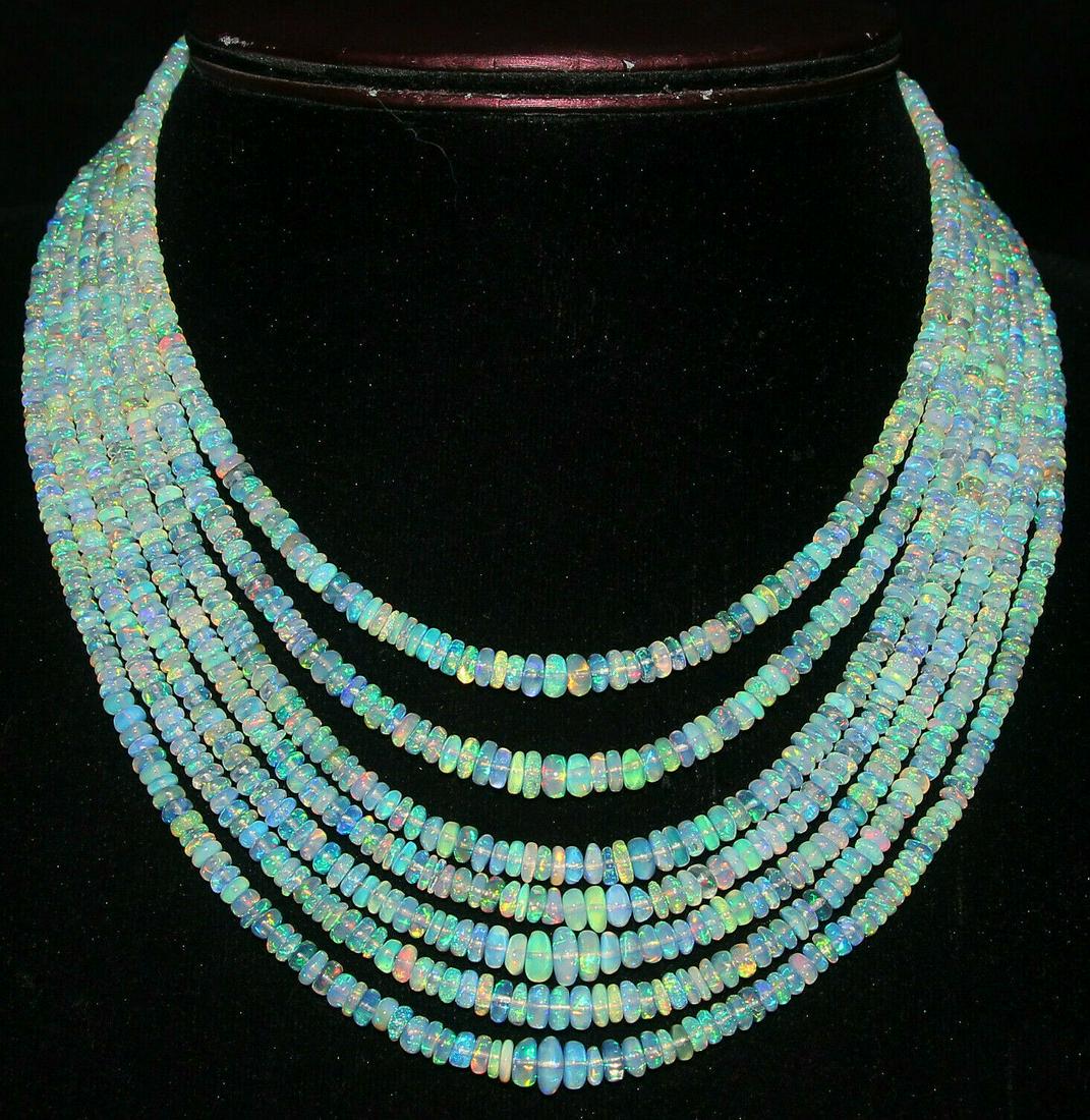 335Crt Natural Ethiopian Welo Fire Opal Beads Necklace: Shape: BeadMaterial: Stone Country of Origin: EthiopiaColor: Multi-ColorCountry/Region of Manufacture: IndiaGemstone: Opal Natural/Lab-Created: NaturalBeads Size: 3.5To7.5 MM Cut Grade: ExcellentTrans