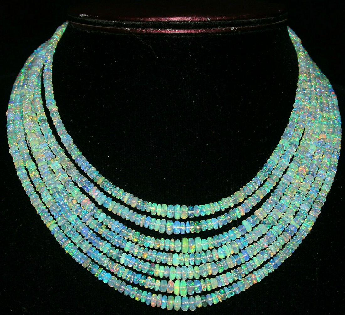 340Crt 7 Strand Natural Ethiopian Welo Fire Opal: Material: Stone Country of Origin: EthiopiaColor: Multi-ColorCountry/Region of Manufacture: IndiaGemstone: Opal Natural/Lab-Created: NaturalBeads Size: 3.5To6.5 MM Cut Grade: ExcellentTransparency: Tr