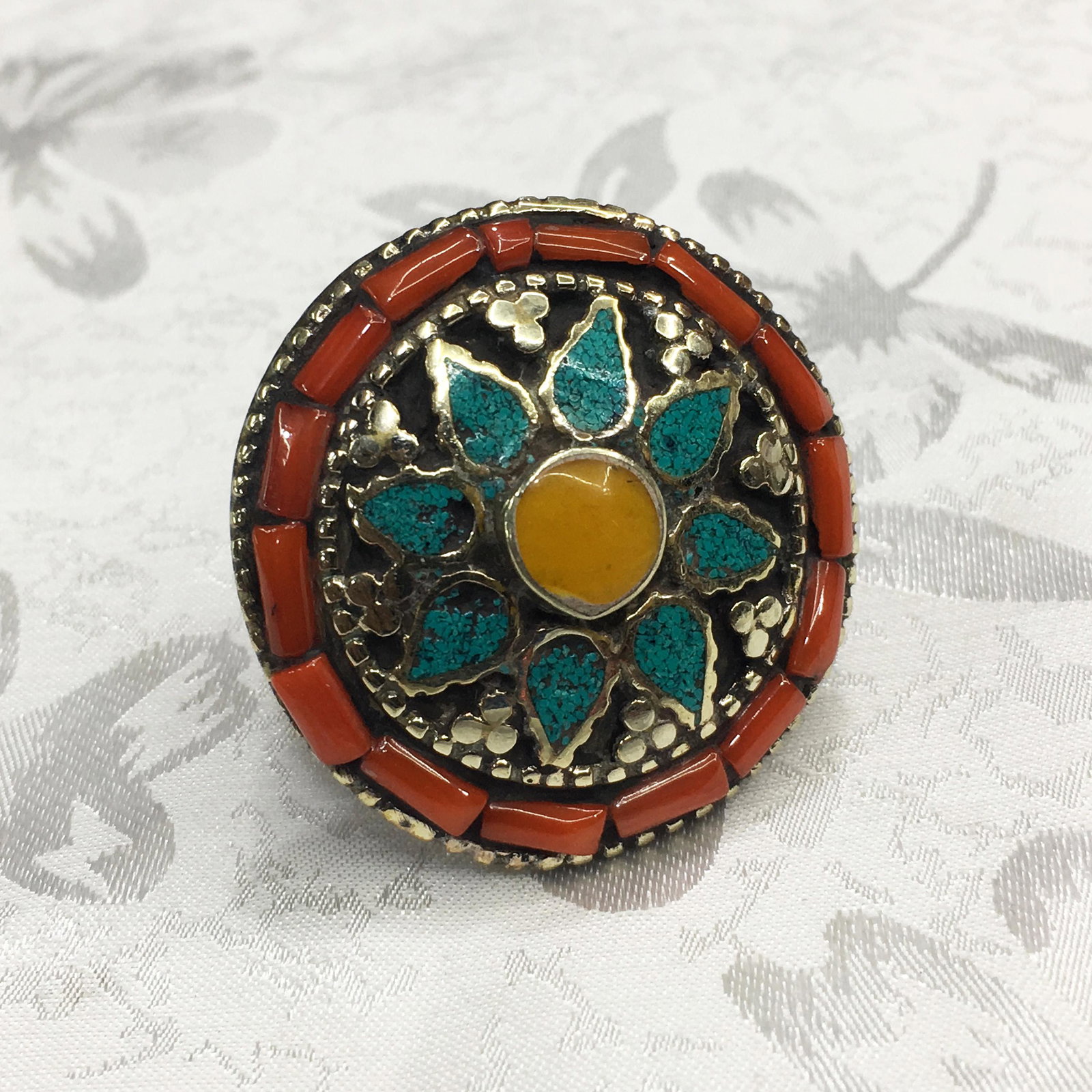 Tibetan Amber & Coral Handmade Ethnic Ring - 9MM: Tibetan Natural Amber & Coral Handmade Ethnic Ring - 9MMWeight: 20 Gram ApproxMetal: Tibetan Silver Gemstones: Amber & CoralBrand: HandmadeSize: 9MMCountry/Region of Manufacture: Nepal