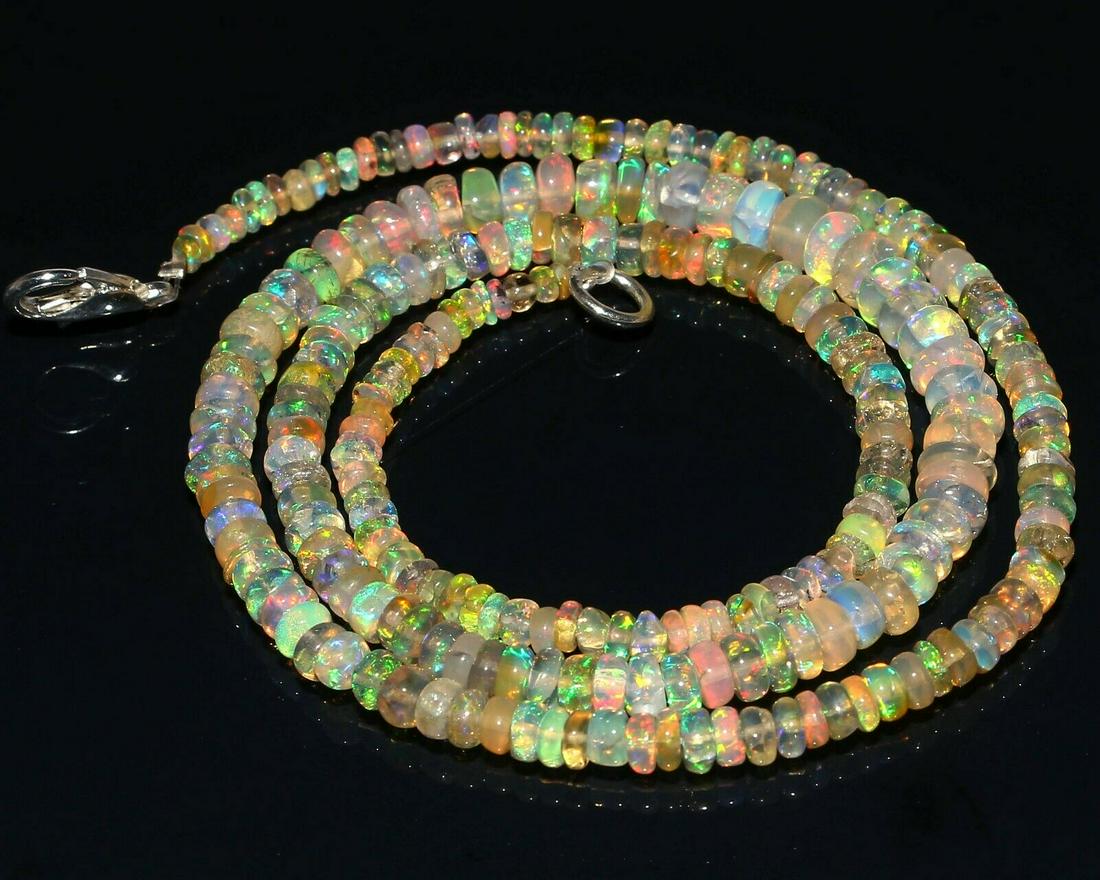 Natural Ethiopian Welo Fire Opal Beads Necklace 38.00: Shape: Bead Cut Grade: SMOOTHCountry of Origin: Ethiopia Color: WhiteCountry/Region of Manufacture: India Transparency: OpaqueNatural/Lab-Created: Natural Treatment: None (No Enhancement)Length: 18 In