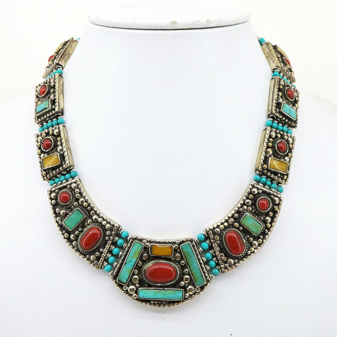 Natural Tibetan Turquoise & Coral Ethnic Necklace: Turquoise encourages growth, development, and positive change within one's life. It is especially useful for clearing the Throat Chakra, and blockages of suppressed self-expression. Coral symbolizes l