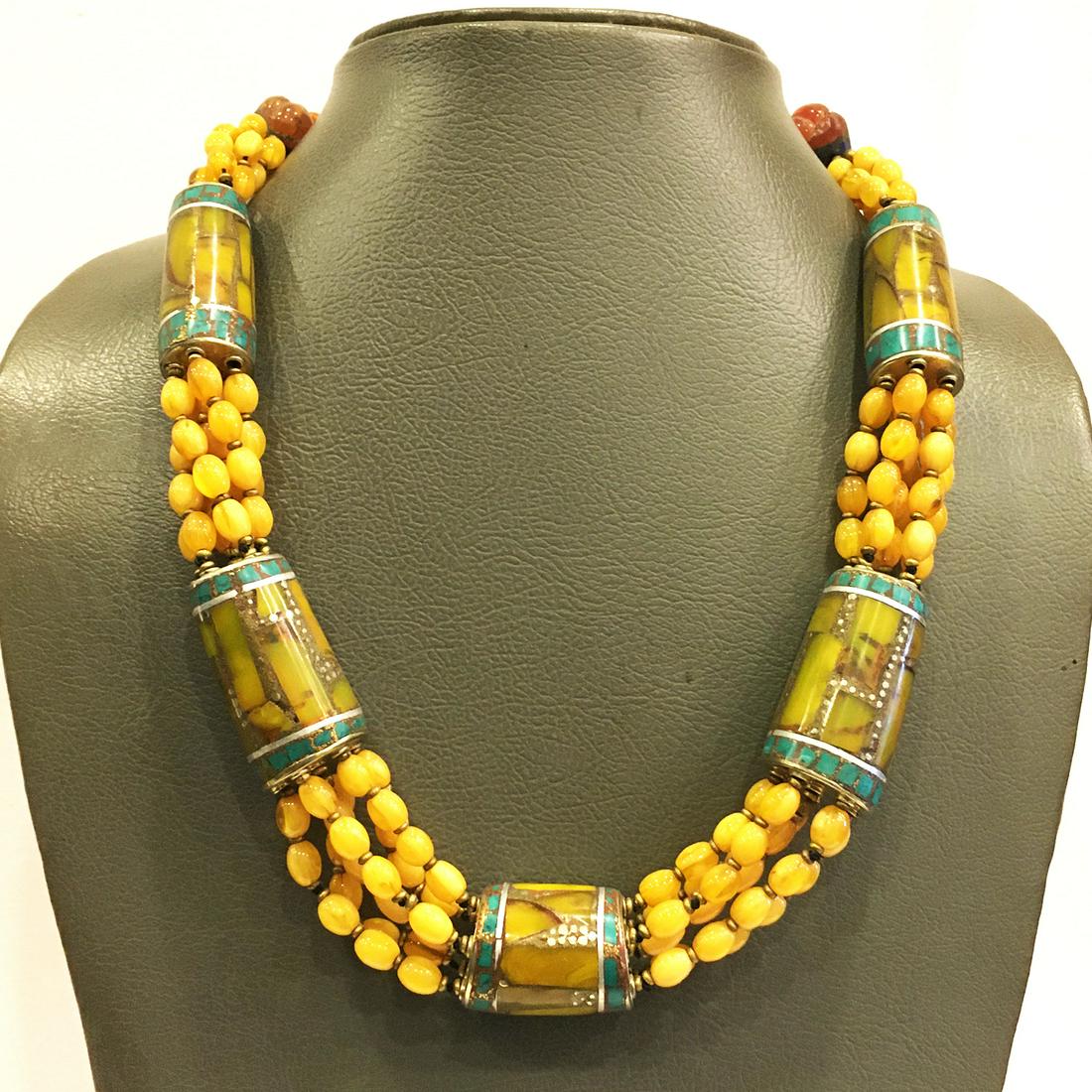 Turquoise & Amber Beaded Ethnic Choker Necklace: Turquoise encourages growth, development, and positive change within one's life. It is especially useful for clearing the Throat Chakra, and blockages of suppressed self-expression. Coral symbolizes l