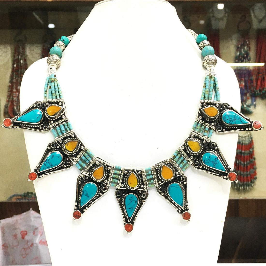 Tibetan Turquoise & Amber Handmade Necklace: Turquoise encourages growth, development, and positive change within one's life. It is especially useful for clearing the Throat Chakra, and blockages of suppressed self-expression. Coral symbolizes l