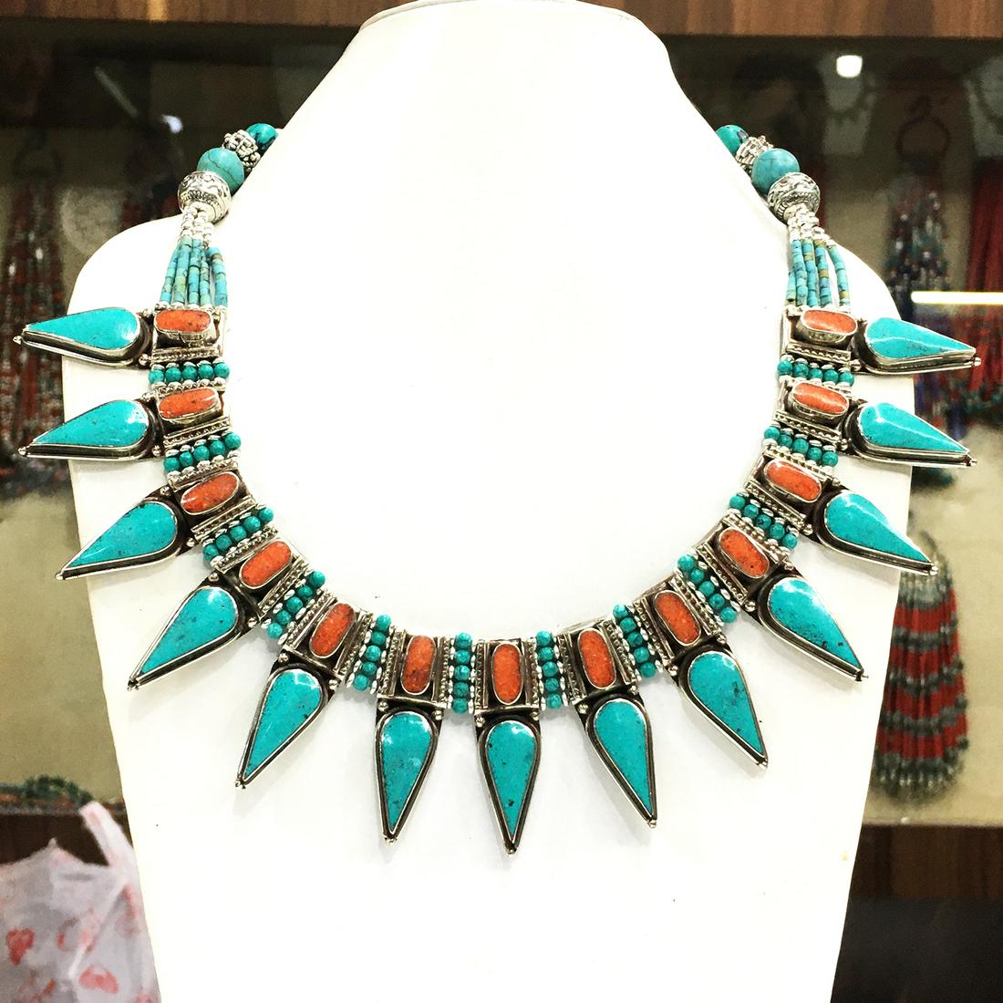 Turquoise & Coral Handmade Choker Necklace: Turquoise encourages growth, development, and positive change within one's life. It is especially useful for clearing the Throat Chakra, and blockages of suppressed self-expression. Coral symbolizes l