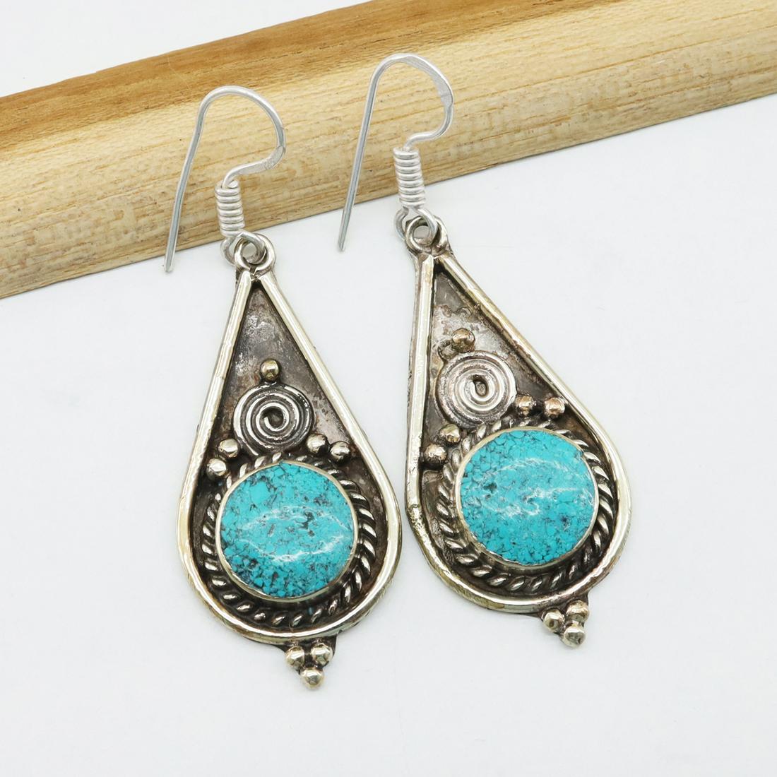 Tibetan Hand-Carved Turquoise Choker Earrings: Tibet Natural Stone Hand Made Turquoise, Coral & Lapis Earring......This elegant Earring was handcrafted in Tibet, the home of exquisite jewelry craftsmanship. It was skillfully made with large natura