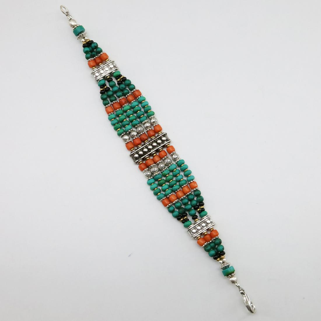 Tibetan Natural Old Turquoise Beaded Bracelet: Turquoise encourages growth, development, and positive change within one's life. It is especially useful for clearing the Throat Chakra, and blockages of suppressed self-expression. Coral symbolizes l