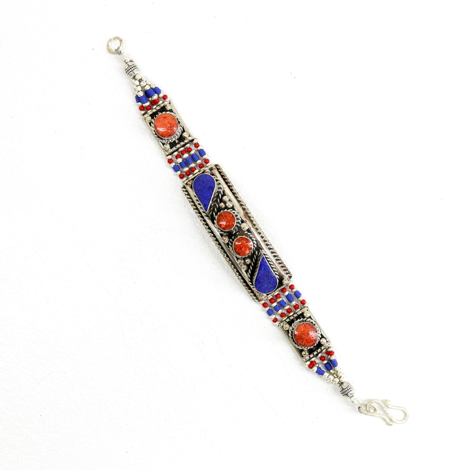 Nepali Lapis & Coral Handmade Choker Bracelet: TIBETAN TURQUOISE & CORAL HANDMADE BRACELETWeight: 30 Gram ApproxGemstones: Turquoise & Coral, LapisBrand: HandmadeBracelet Length: 6 to 7 InchCountry/Region of Manufacture: Kathmandu/Nepal