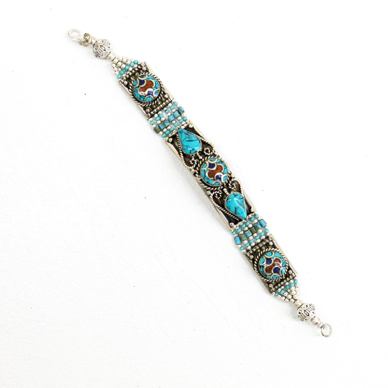 Ethnic Tibetan Turquoise Choker Handmade Bracelet: TIBETAN TURQUOISE & CORAL HANDMADE BRACELETWeight: 30 Gram ApproxGemstones: Turquoise & Coral, LapisBrand: HandmadeBracelet Length: 6 to 7 InchCountry/Region of Manufacture: Kathmandu/Nepal