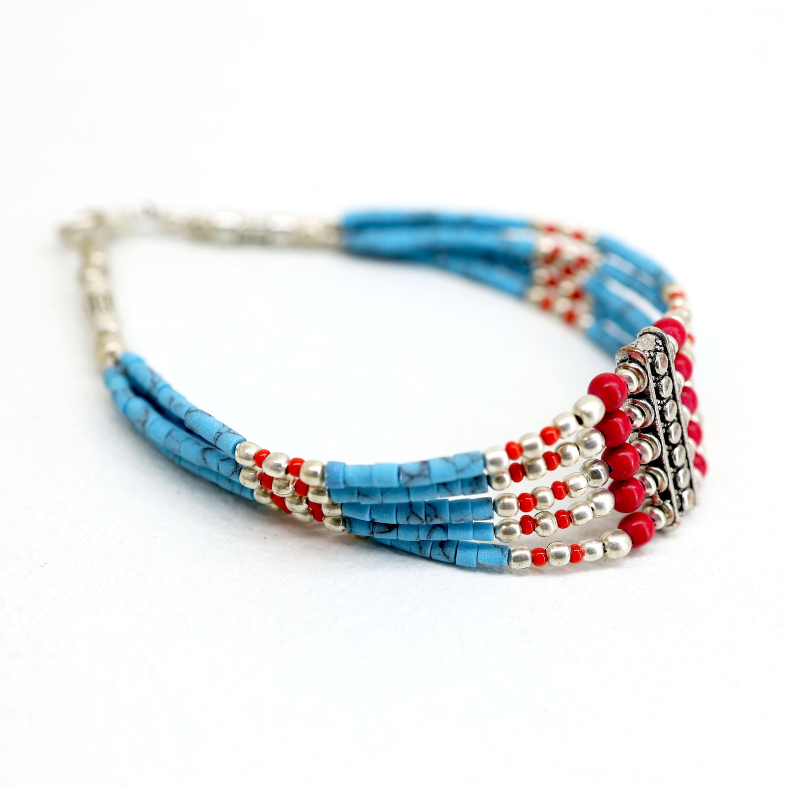 Tibetan Turquoise Handmade 5 Line Bracelet: TIBETAN TURQUOISE & CORAL HANDMADE BRACELETWeight: 10 Gram ApproxGemstones: Turquoise & Coral, LapisBrand: HandmadeBracelet Length: 7 to 8 InchCountry/Region of Manufacture: Kathmandu/Nepal