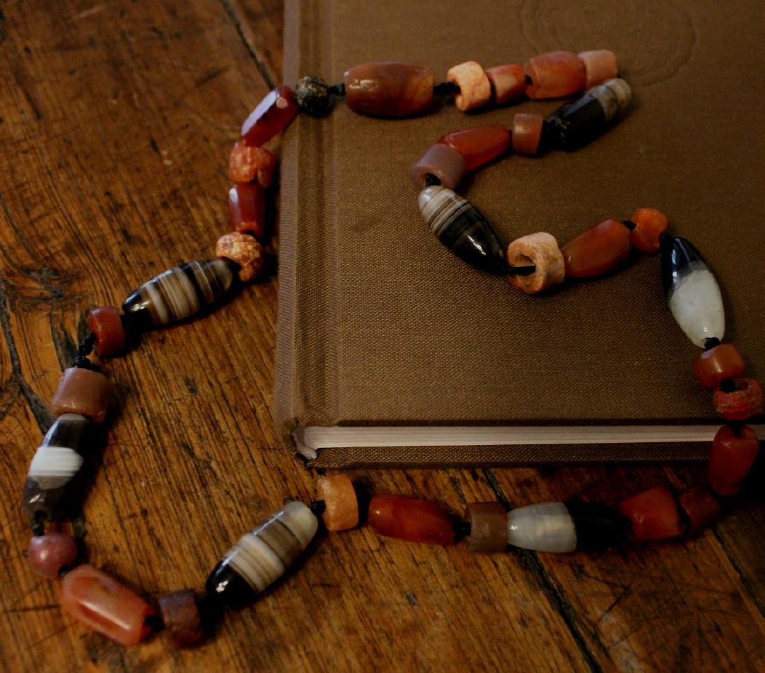 chinese carnelian beads necklace: chinese carnelian beads necklace, qing dynasty or earlier. Length: 60cm. Dia: about 1cm, 2.5cm the longest.shows age, expected wear and chips.