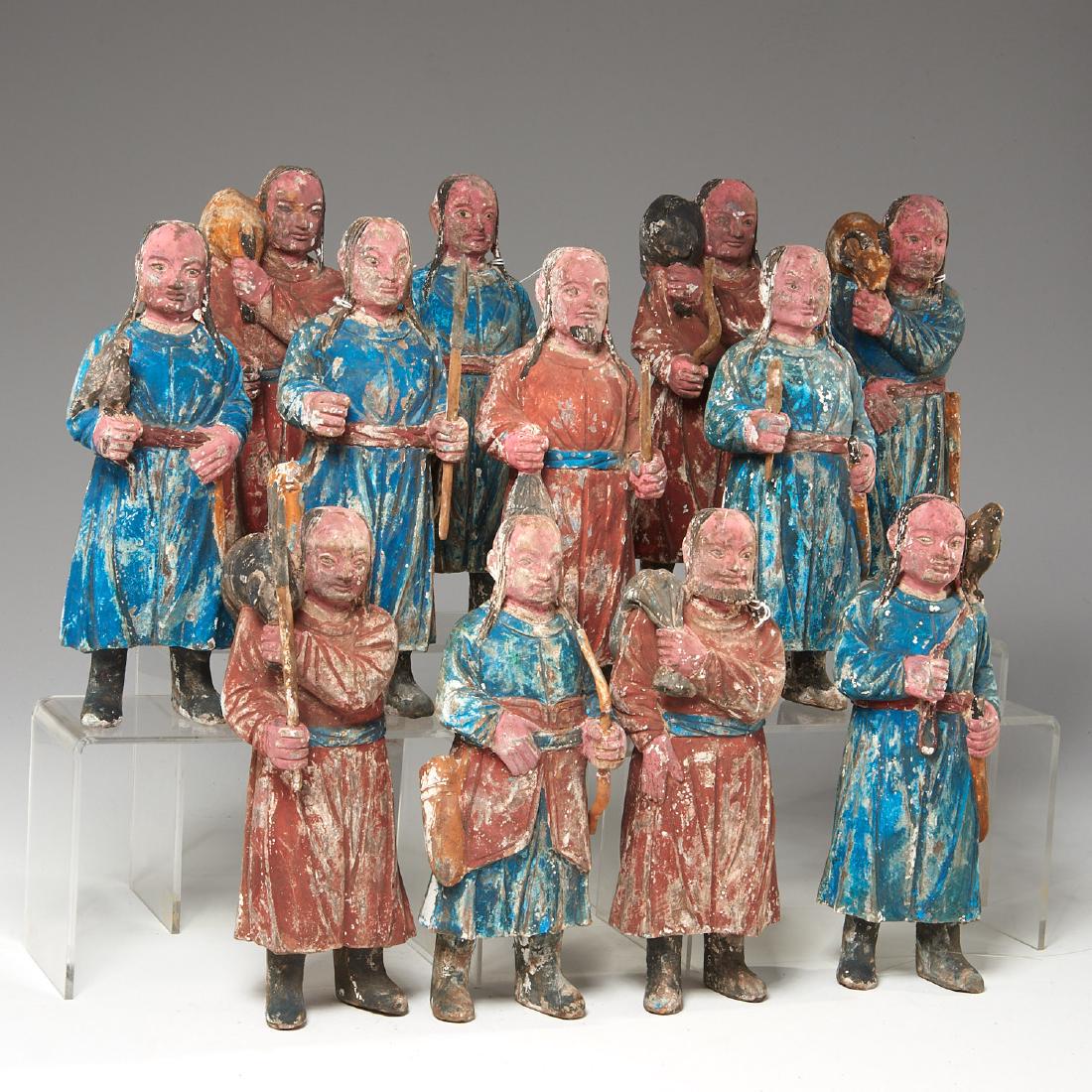 wood Northern Mongolian chinese hunting figures: 12 Northern Mongolian chinese hunting figures, Possibly late Liao Dynasty (c. 1150), carved and polychromed wood, each holding animals or weapons, each approx. 10.5"h. Provenace: Christie's and Mille