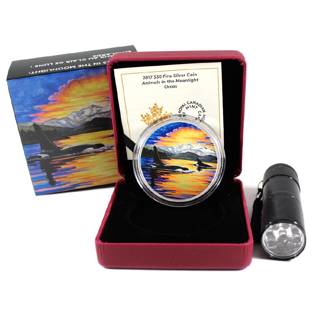 2017 Canada $30 Animals in the Moonlight - Orcas 2oz: 2017 Canada $30 Animals in the Moonlight - Orcas 2oz Fine Silver Coin (TAX Exempt). This 2-ounce 99.99% Pure Silver Coin measures 54mm in diameter with a limited mintage of 4000 and features Glow-in-t
