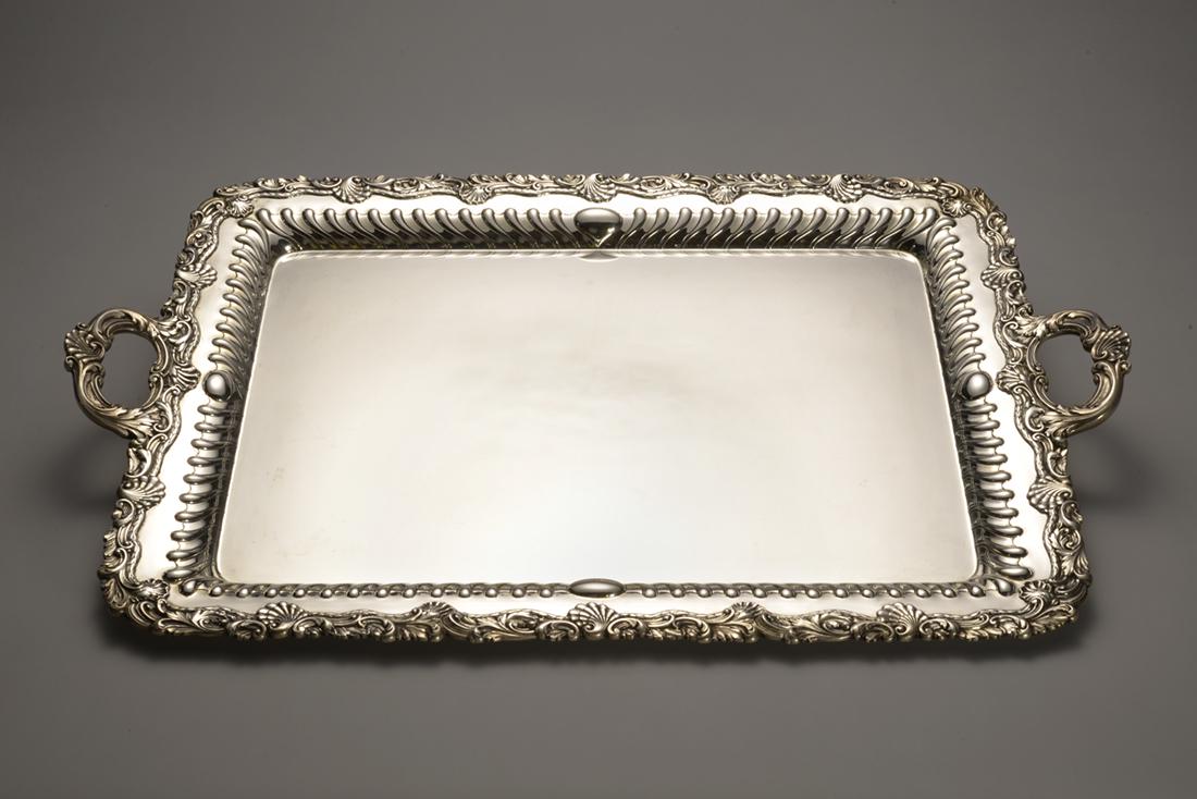 Gorham Sterling Silver Tray: This sterling silver tray is an original Gorham weighing in at 4750 grams. The intricate etchings done on the sides of the tray & the handles make this a wonder to behold. Their ornate additions liven
