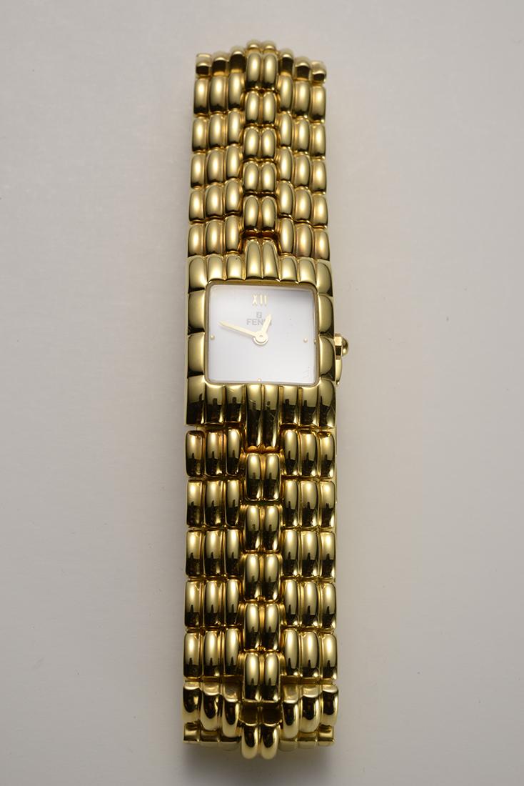 Vintage Fendi Ladies Gold Plated Watch, Never used: This watch has never been worn, purchased in the 1980's, so it is in excellent condition. The face of the watch is white with in roman numerals XII.