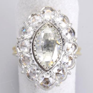 Antique Marquis Diamond Gold Ring: There are 1.40 carats for the 12 round old mined diamonds and the Marquis Diamond Approximately 1.80 carats I color VVS2 18 carat gold 7.20 grams A very lovely Antique Ring a very graceful original mo